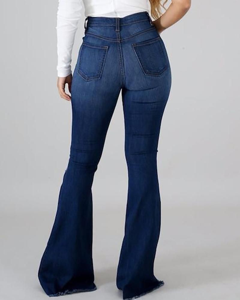 High-waisted distressed flare jeans